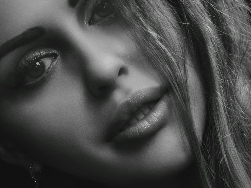 Close up of eye and digital light wave representing focus