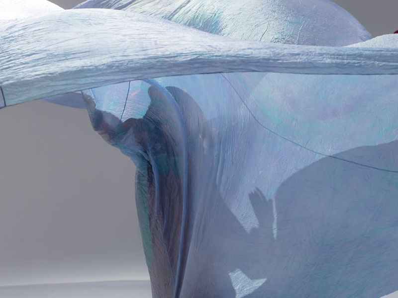 Modern minimalist studio space with soft blue lighting